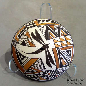 Dragonfly and geometric design on a polychrome seed pot