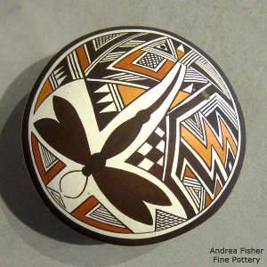 Dragonfly and geometric design on a polychrome seed pot