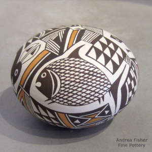 Mimbres animals and geometric design on a polychrome seed pot