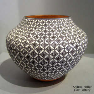 Black and white geometric design on a polychrome jar
