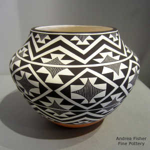 Black and white geometric design on a polychrome jar