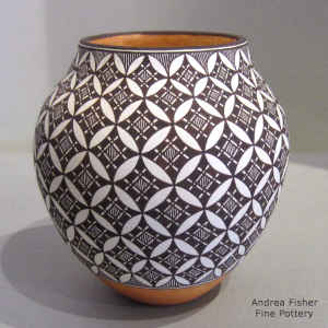 Pumpkin seed geometric design on a polychrome jar
