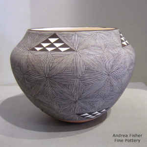 Snowflake fine line and geometric design on a polychrome jar