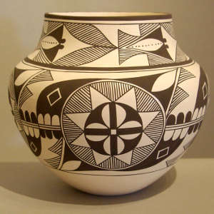 Medallion and geometric design on a black and white jar
