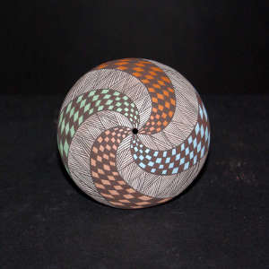 Swirl checkerboard and fine line design on a polychrome seed pot