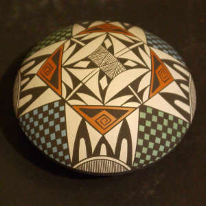 Geometric and shard design on a polychrome seed pot