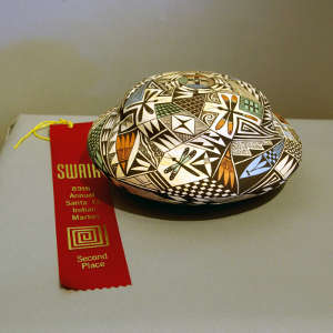 Dragonfly, shard and geometric design on a polychrome flying-saucer-shaped seedpot