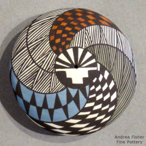 Fine line, swirl and geometric design on a polychrome seedpot