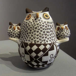 Owl effigy with two children