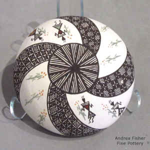 Mimbres dancers, corn plants, fine line and a spiral geometric design on a miniature polychrome seed pot