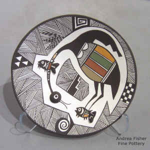 Cloudeater, fish, fine line and geometric design on a polychrome plate