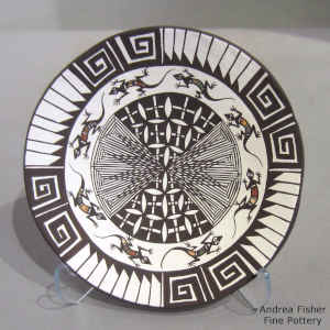 Bird, fish, fine line and geometric design on a polychrome plate