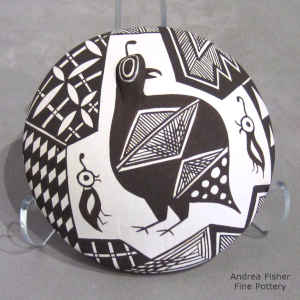 Quail, sherd and geometric design on a black and white seed pot