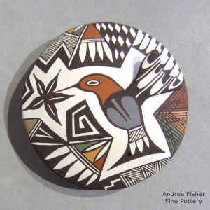 Hummingbird, flower and geometric design on a polychrome seed pot