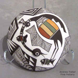 Cloudeater, fish, fine line and geometric design on a polychhrome seed pot