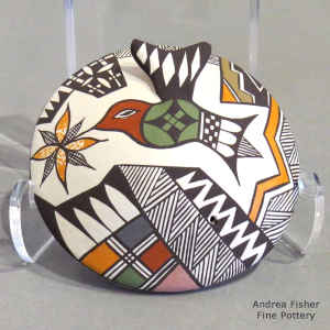 Hummingbird, flower and geometric design on a polychrome seed pot