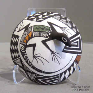 Lizard and geometric design on a polychrome seed pot