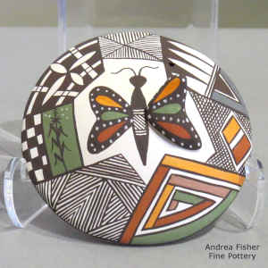 Butterfly, fine line and geometric design on a miniature polychrome seed pot