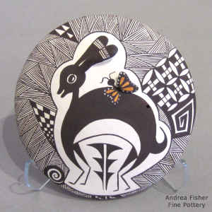 Mimbres rabbit, butterfly, fine line and geometric design on a polychrome seed pot