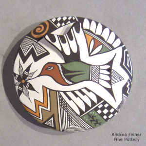 Hummingbird, flower and geometric design on a polychrome seed pot