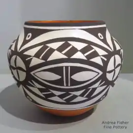 Black-on-white geometric design on a polychrome jar