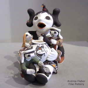 Click to see a larger version 2 children, puppy, birds, turtle and geometric design on a grandmother storyteller