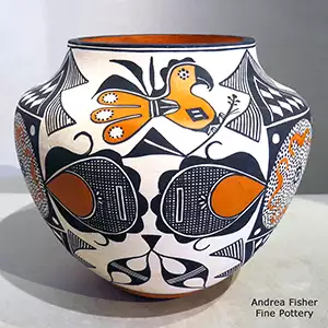 A parrot, checkerboard and geometric design on a polychrome jar