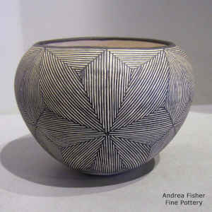 Snowflake fine line design on a black and white jar