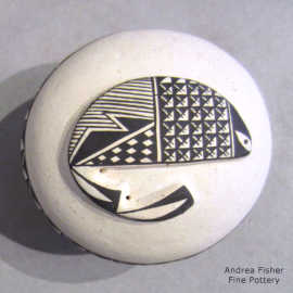 Geometric design plus a sculpted fish on a miniature black-on-white seed pot