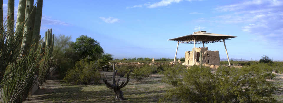 Looking across the grounds of Casa Grande National Monument to the roof over the last large piece of the old pueblo
