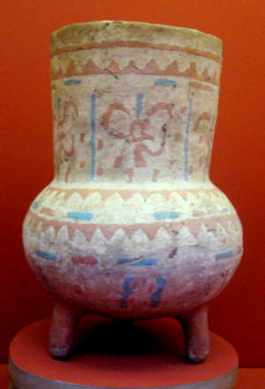 A polychrome Hohokam jar with geometric designs and three legs