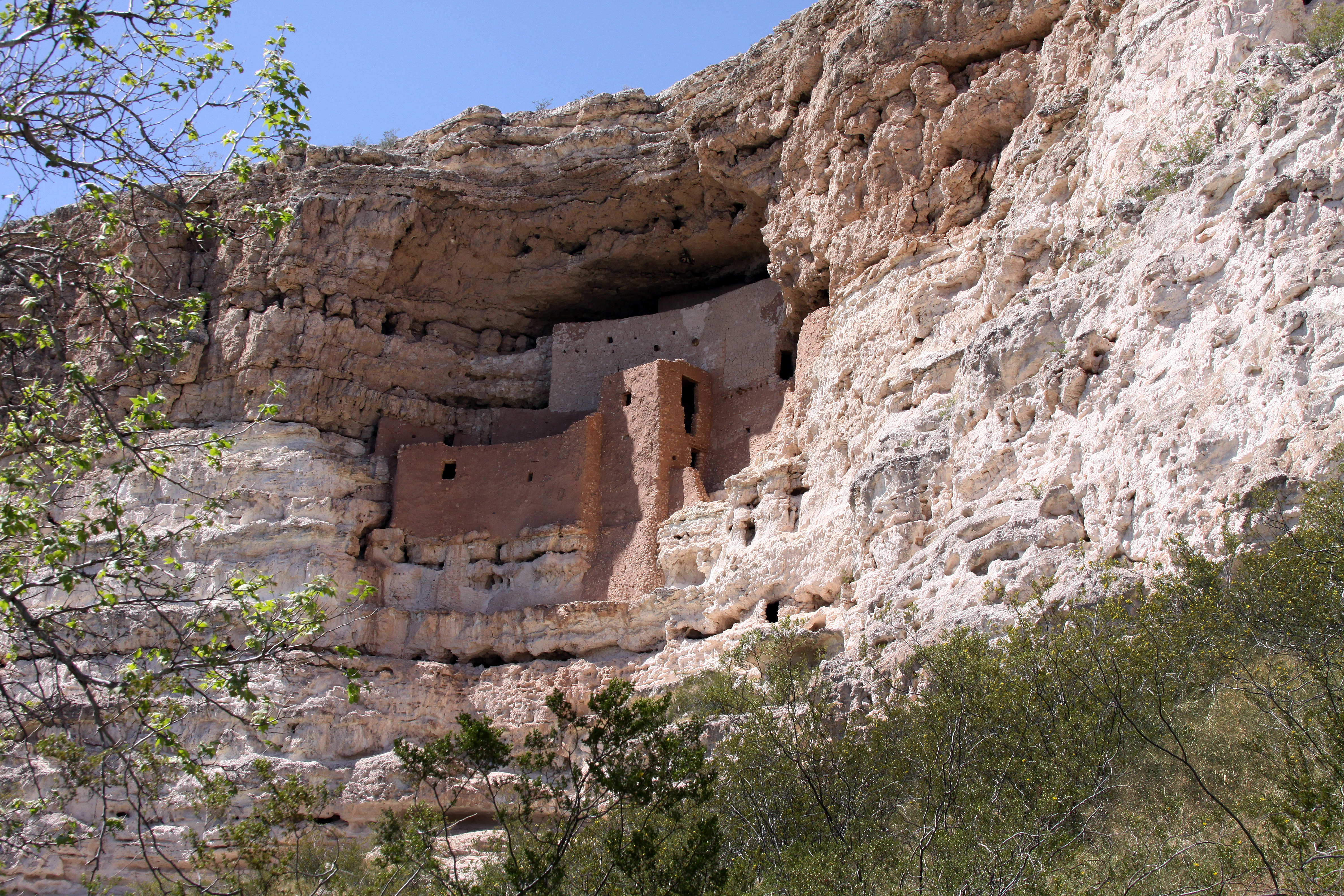 Looking up at the ancient stone architecture structure of Montezuma Castle