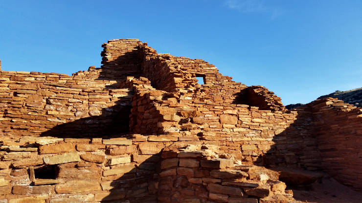 Looking at Wupatki ruin from up on a roof. Much of the building has been restored so the walls are quite high in places