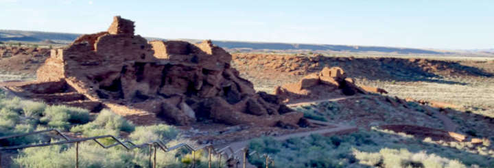 Looking down on Wupatki ruin with the grand kiva out front. Much of the building has been restored so the walls are quite high in places