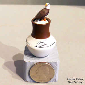 Polychrome miniature jar with a geometric design and bald eagle on the lid