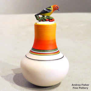 Polychrome miniature jar with a geometric design and finch on the lid