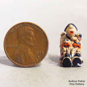 Miniature grandmother storyteller figure with 7 children