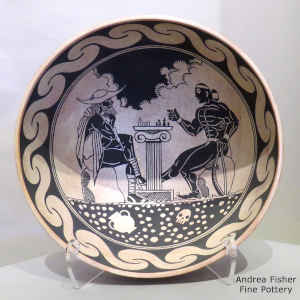 Micaceous red on the outside and black and white Socrates plays chess with Chongo on the inside