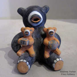 Bear storyteller figure with two cubs