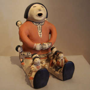 Seven children on a polychrome storyteller