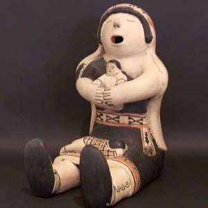 Two children on a storyteller figure