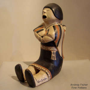 1 child in a blanket on a grandfather storyteller