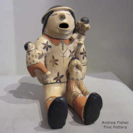 3 children on a grandfather storyteller figure