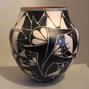 Click for a larger version Black and white geometric designs on a polychrome jar