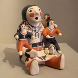 Three children on a grandmother storyteller