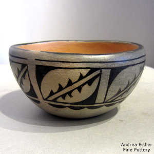 Geometric design on the outside of a polychrome bowl