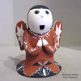 A geometric design on a polychrome Singing Angel figure