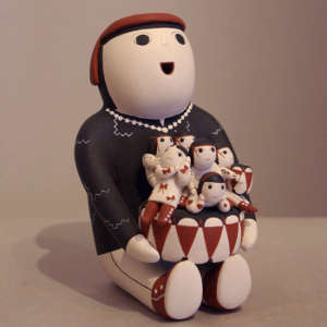 Six children and a drum on a male storyteller