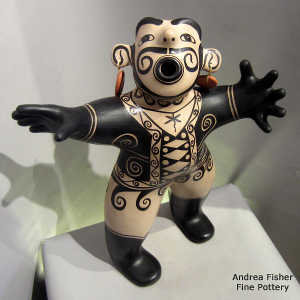 Dangling earrings on a black and white circus ringmaster figure