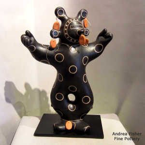 Mudhead figure in black on white